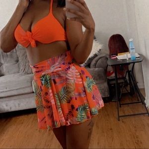 Orange three piece swim suit skirt set